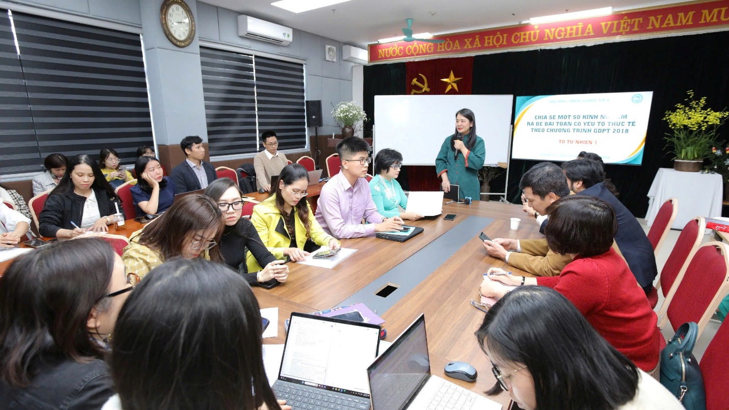 A group of people sitting around a tableDescription automatically generated