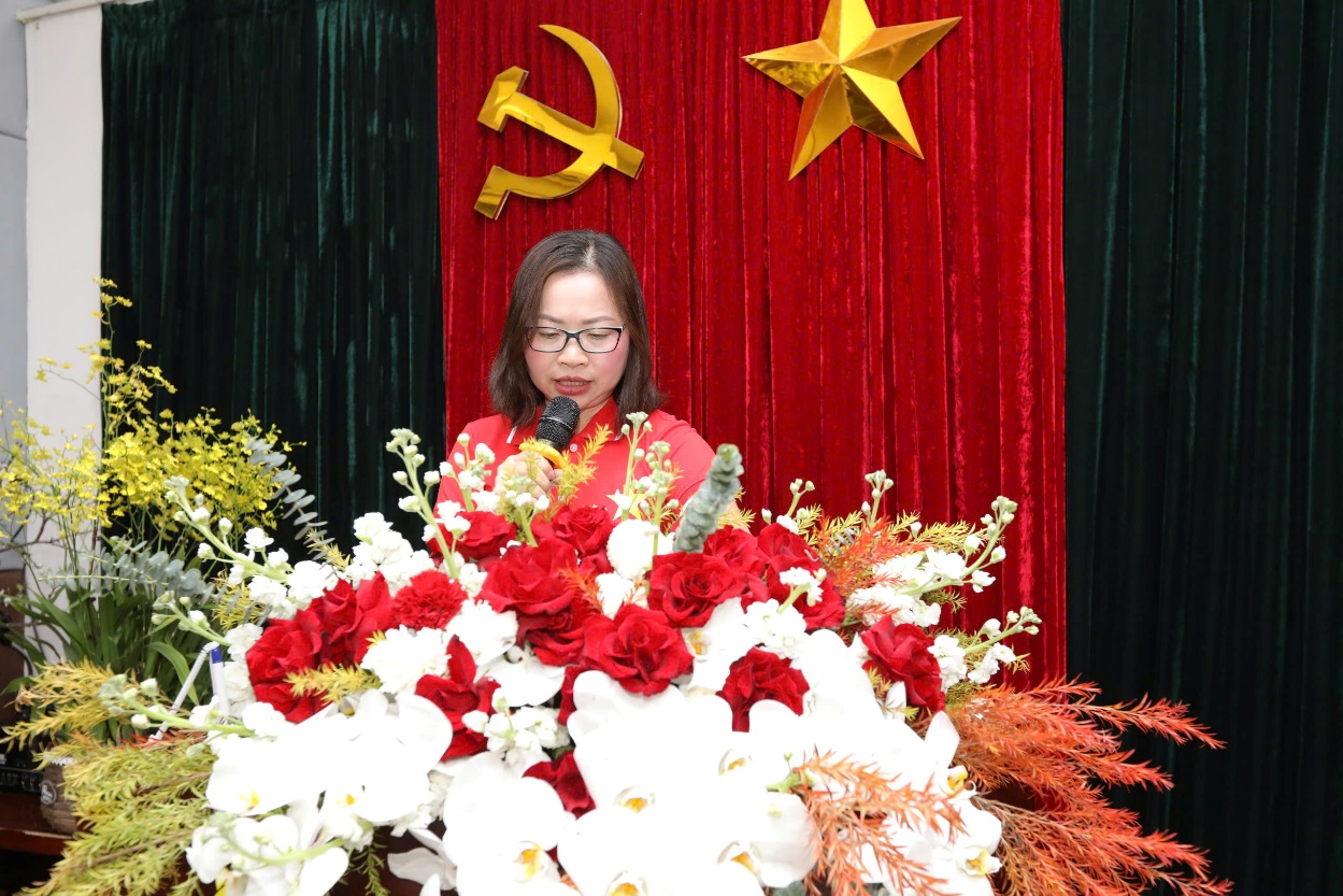 A person speaking into a microphoneDescription automatically generated