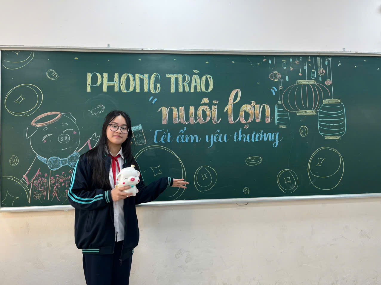 A person standing in front of a chalkboardDescription automatically generated