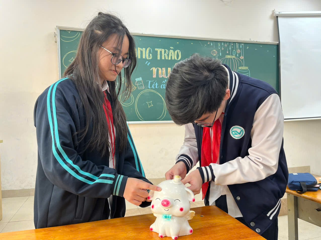 A person and person putting a coin into a piggy bankDescription automatically generated