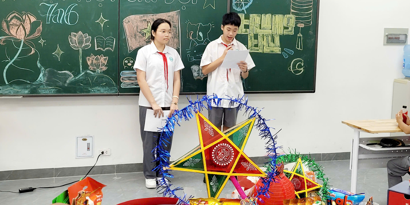 A couple of students standing in front of a blackboardAI-generated content may be incorrect.