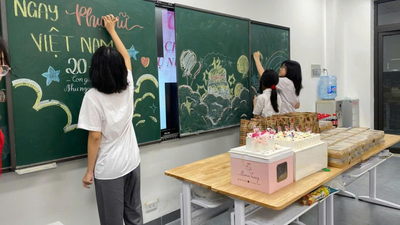 A person and a child writing on a chalkboardAI-generated content may be incorrect.