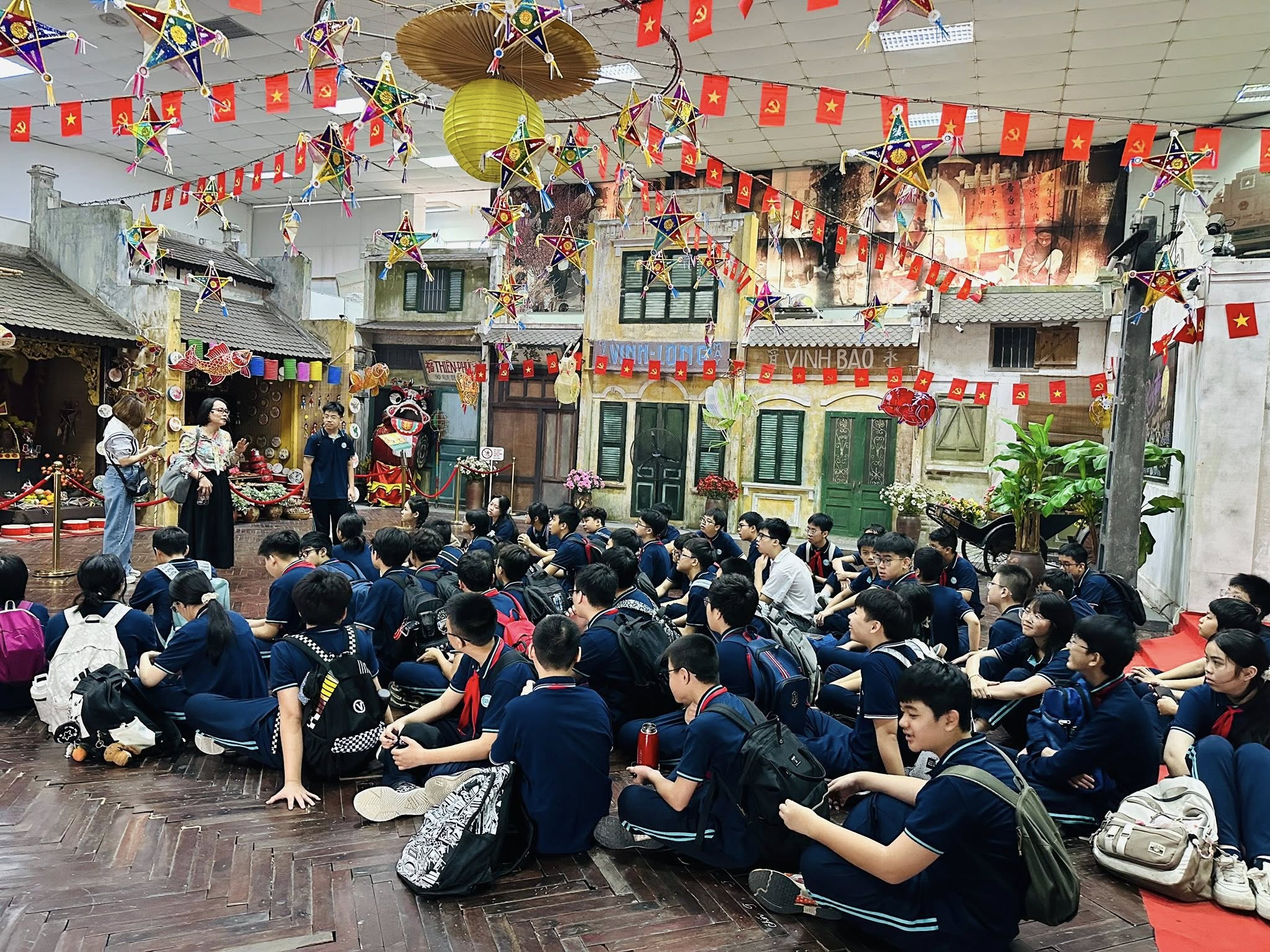 May be an image of one or more people, crowd, temple and text