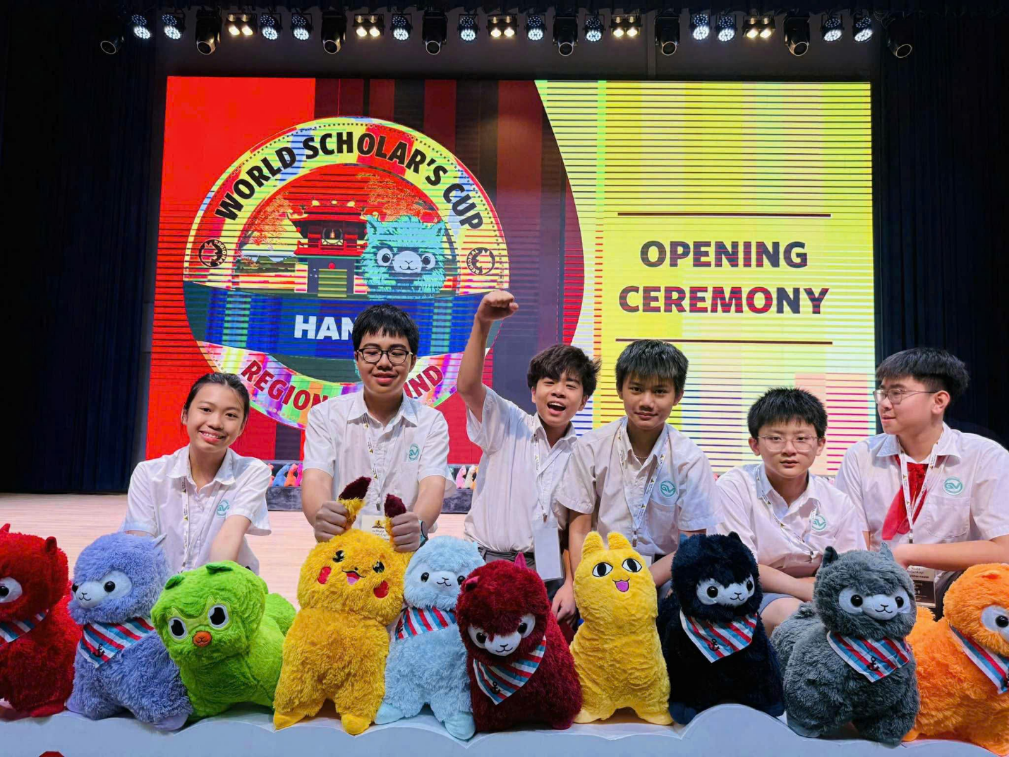 A group of people posing for a photo with stuffed animalsAI-generated content may be incorrect.