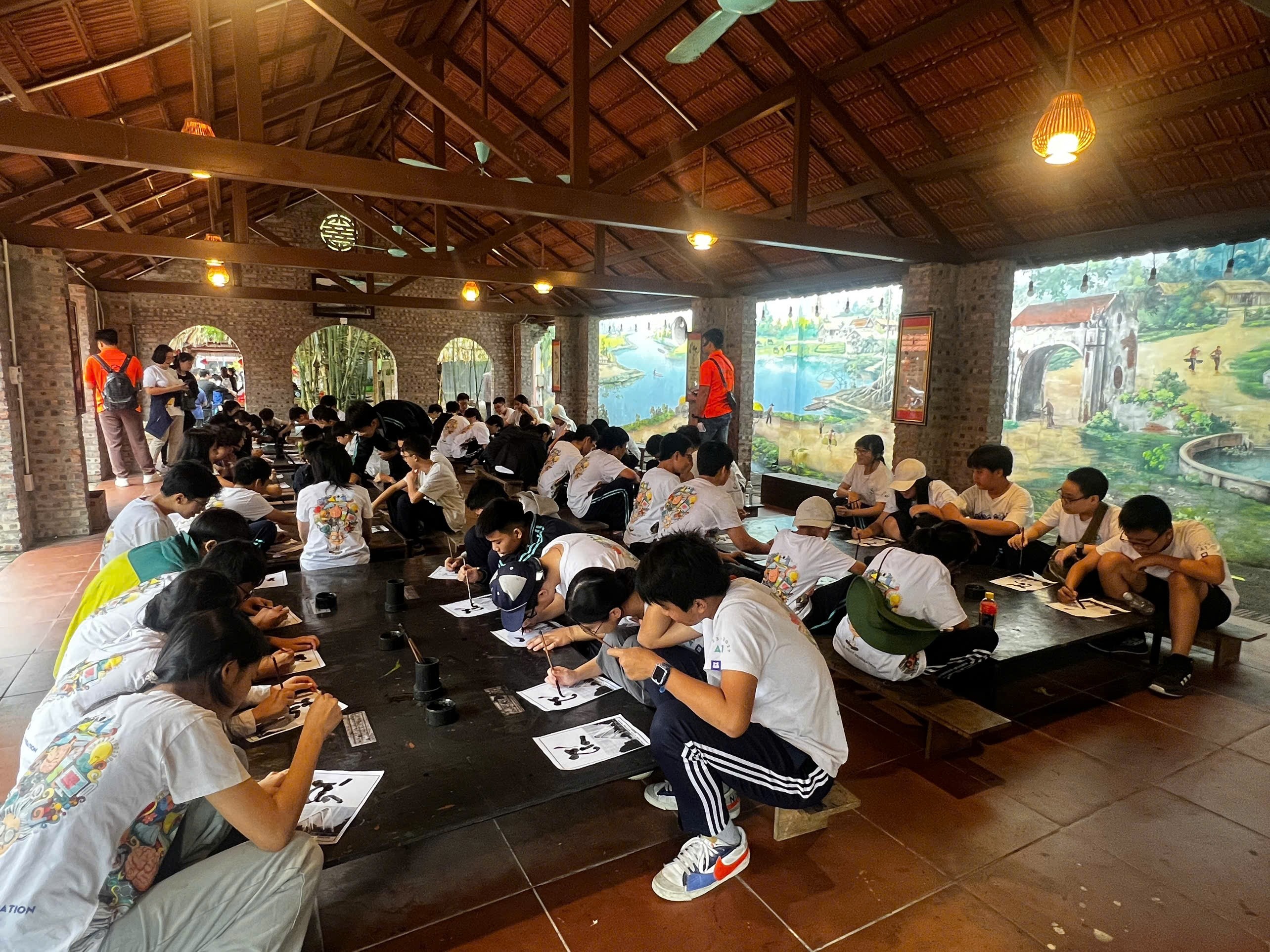 A group of people sitting at a tableAI-generated content may be incorrect.