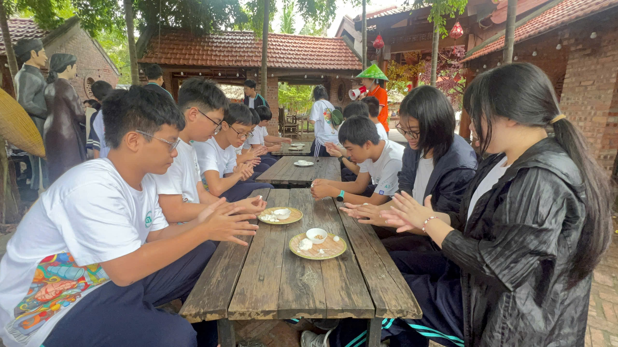 A group of people sitting at a tableAI-generated content may be incorrect.