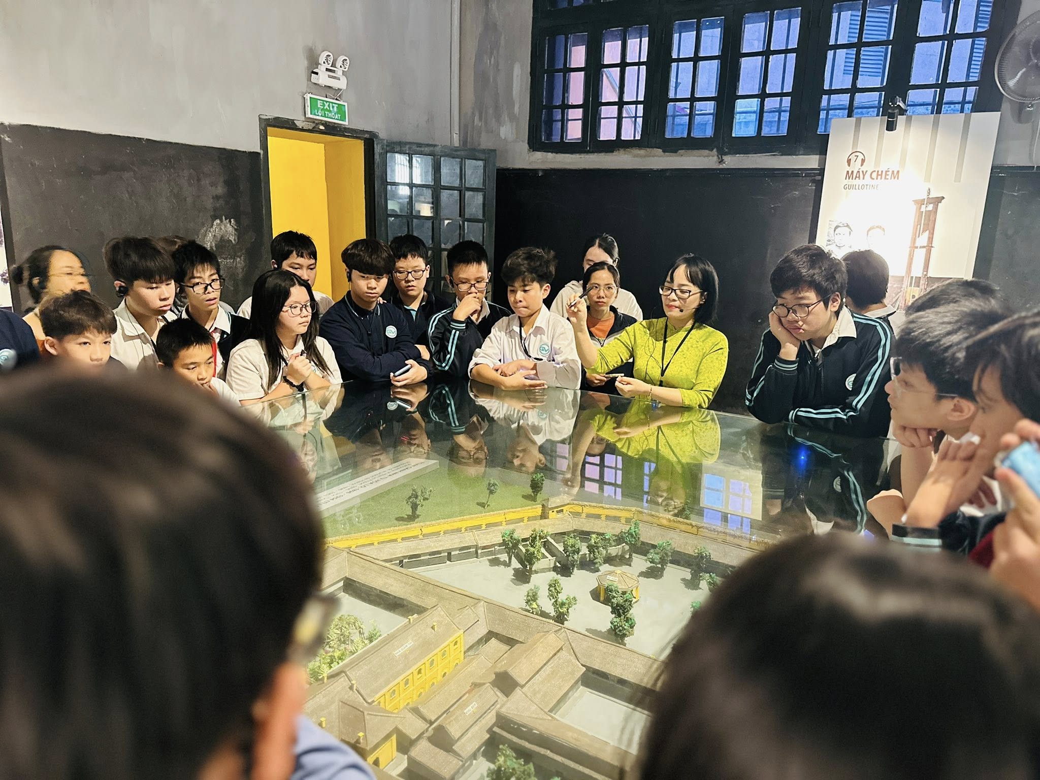 May be an image of one or more people, people studying and text