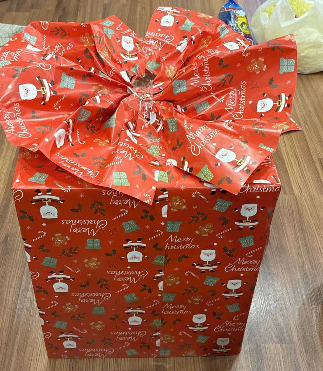 A large red box with a bowDescription automatically generated