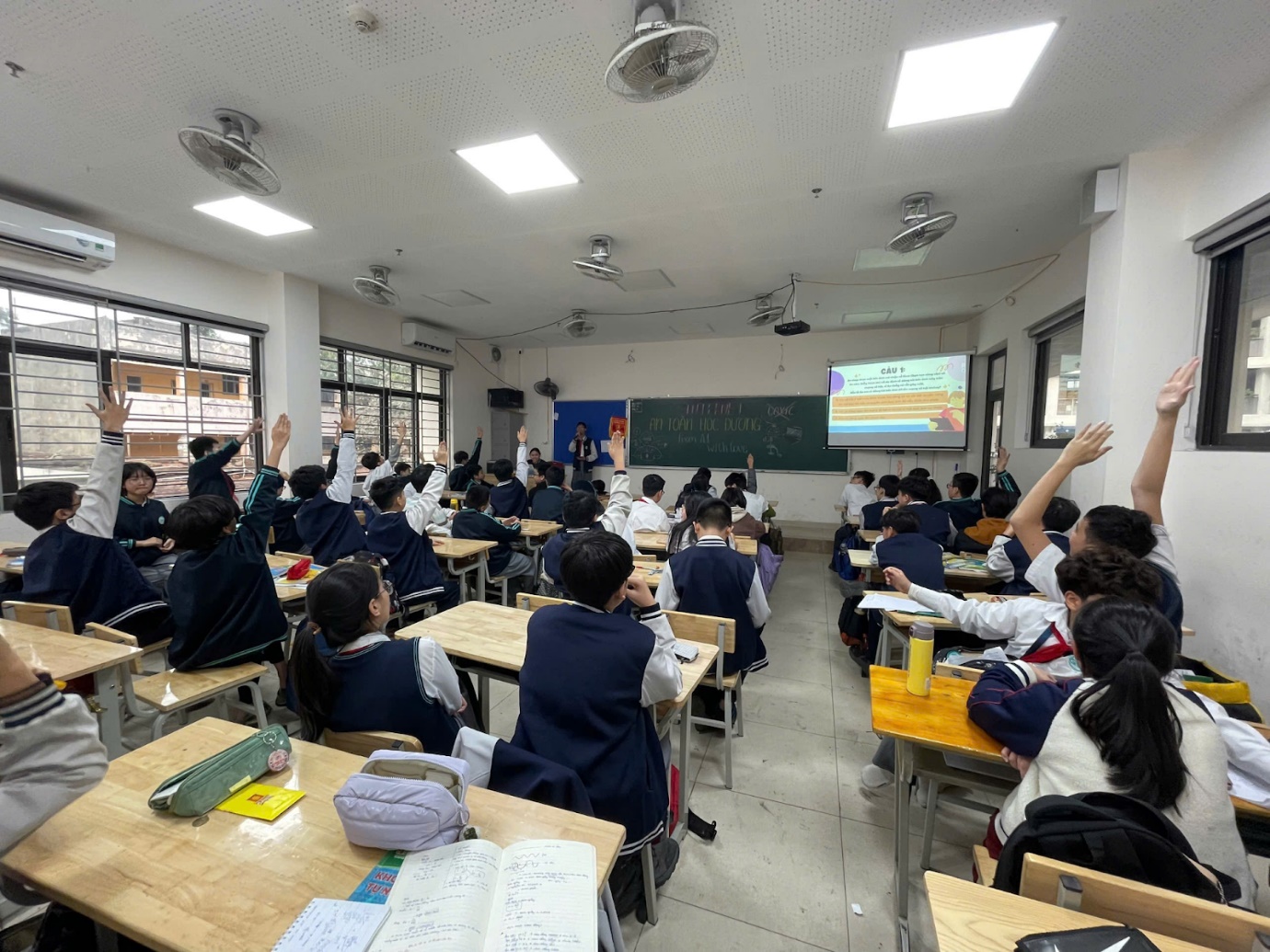 A group of students in a classroomAI-generated content may be incorrect.