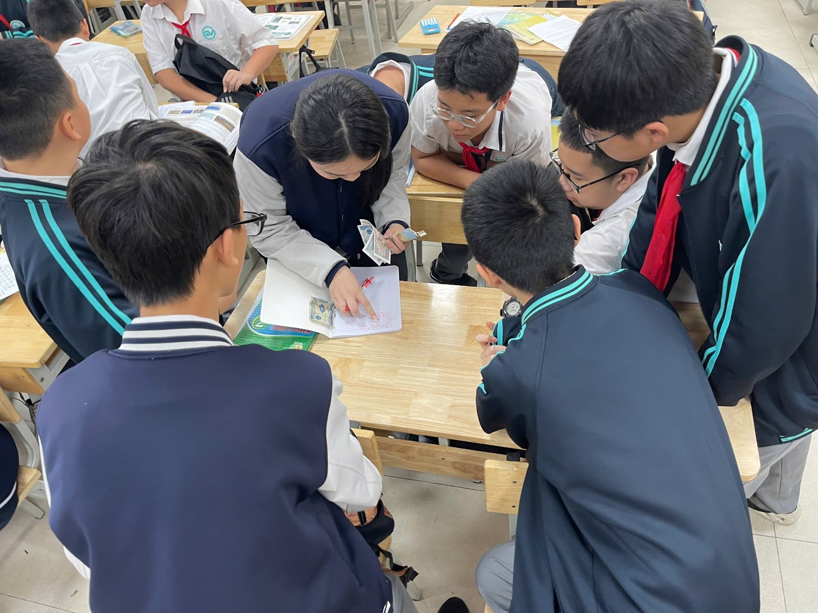 A group of people in a classroomAI-generated content may be incorrect.