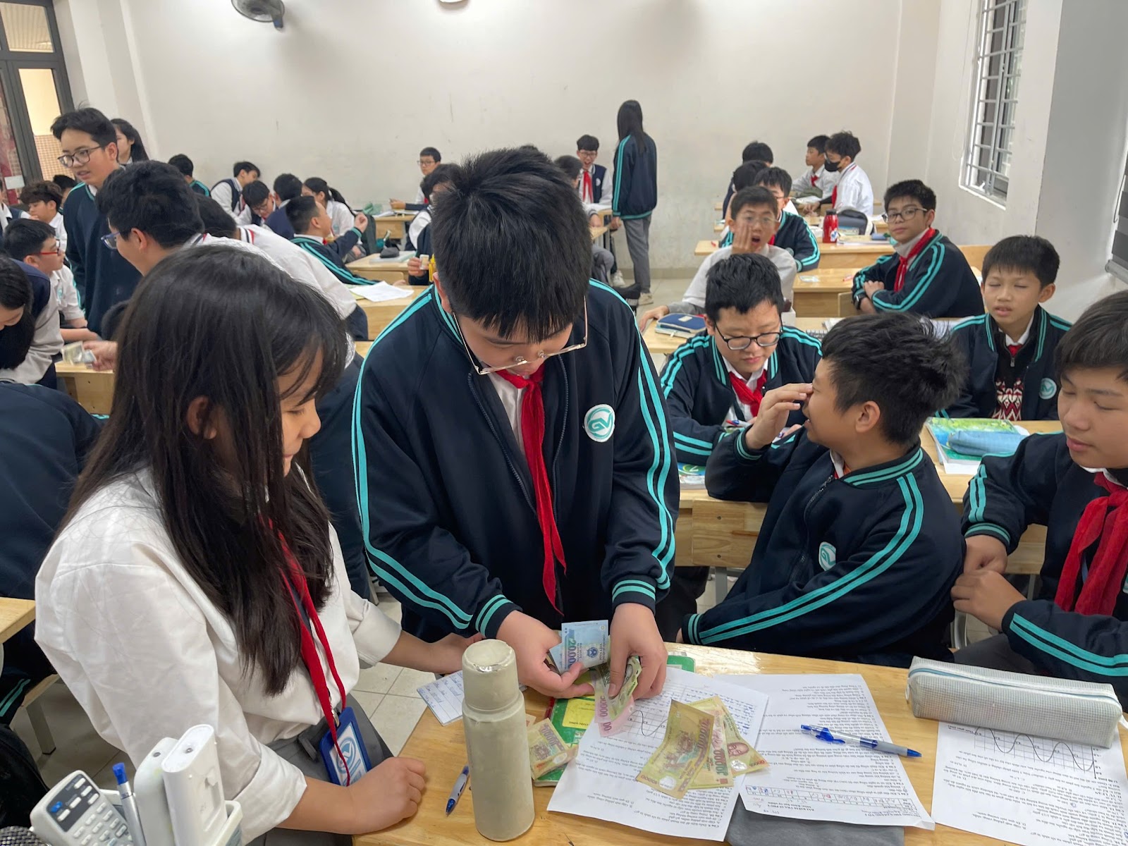 A group of students in a classroomAI-generated content may be incorrect.