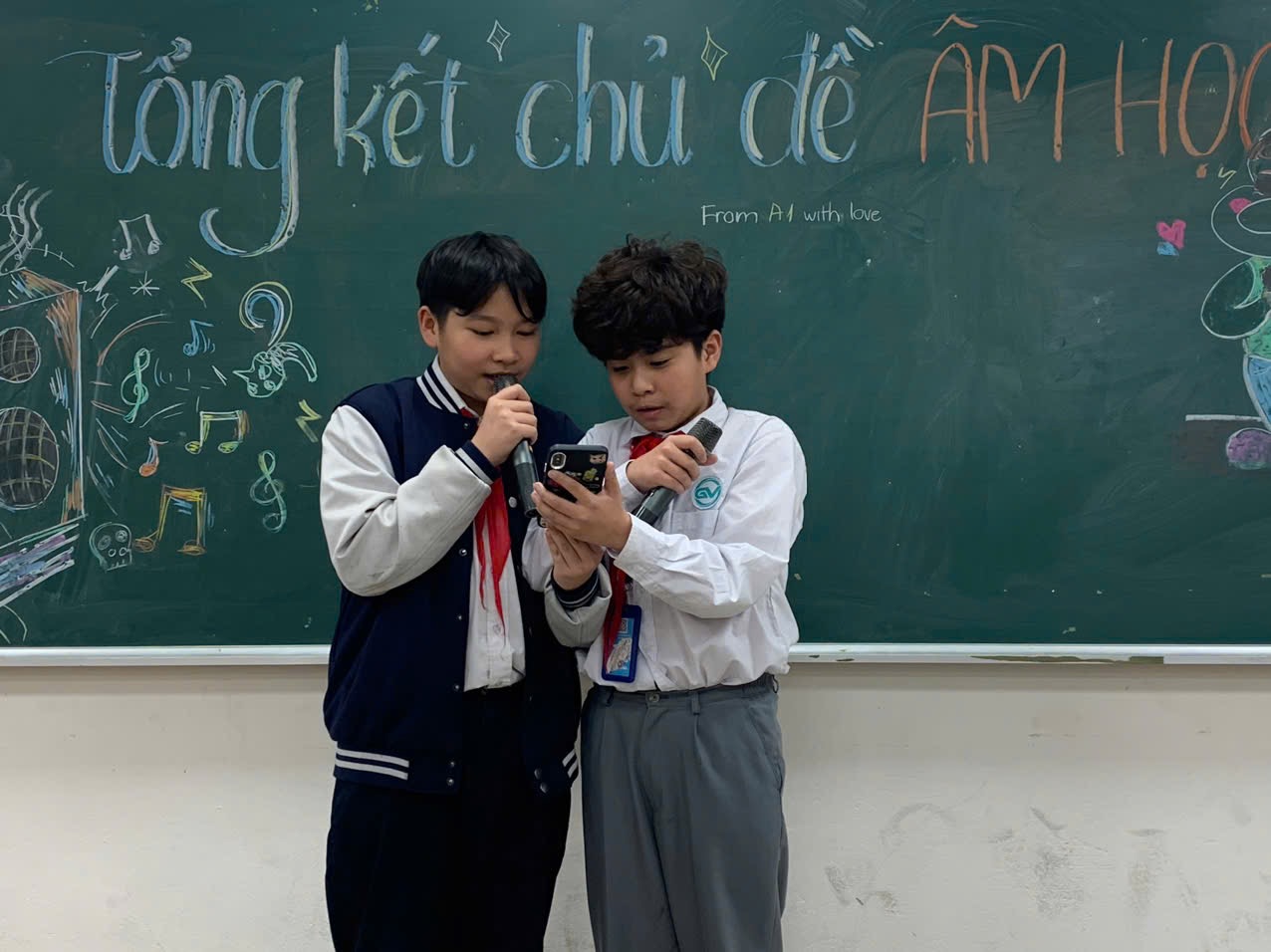 A pair of boys standing in front of a chalkboardAI-generated content may be incorrect.