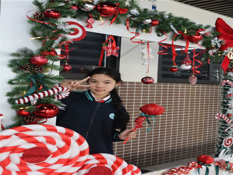 A child holding a flower and a candy caneAI-generated content may be incorrect.