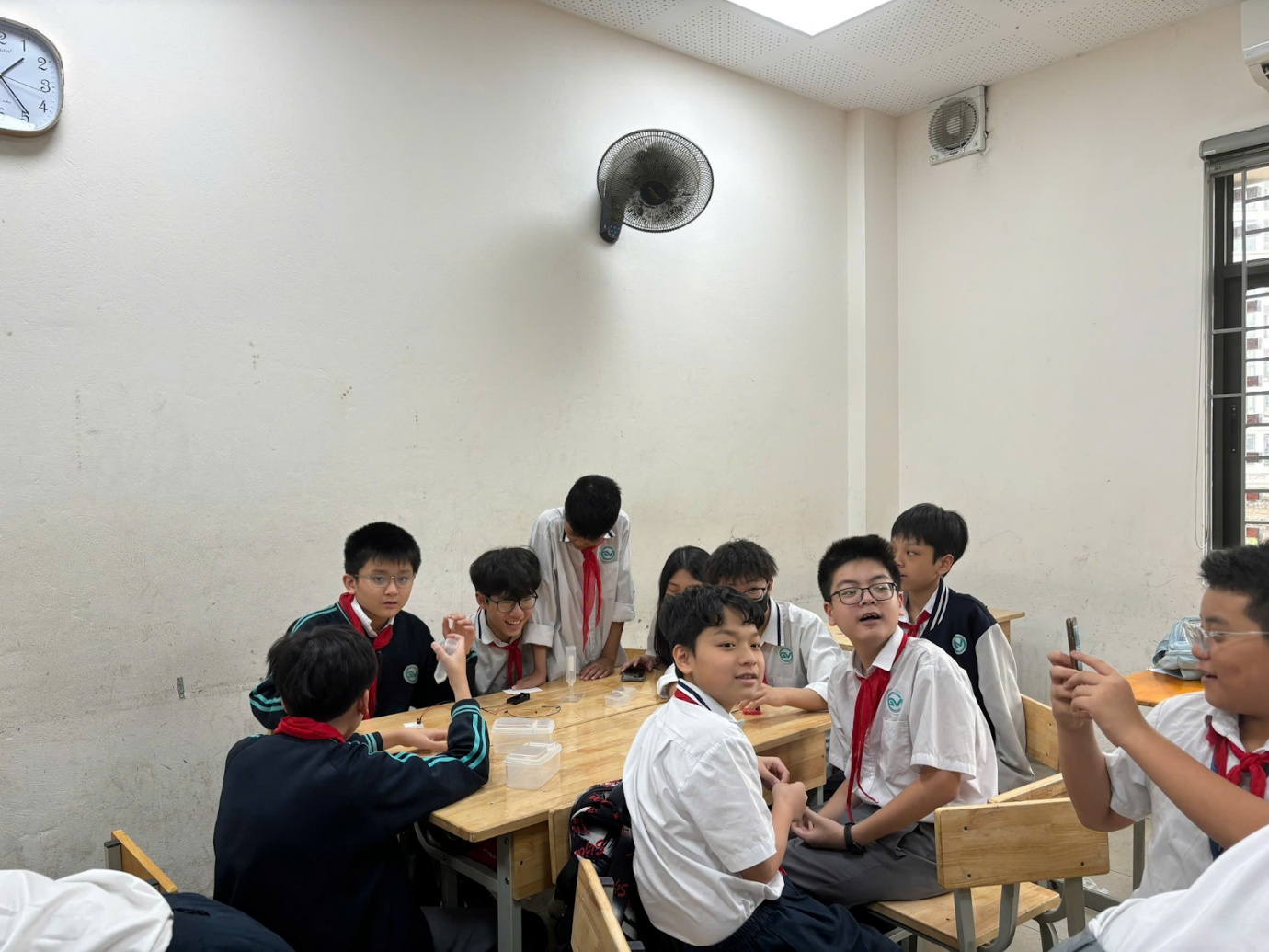 A group of kids sitting at desks in a classroomAI-generated content may be incorrect.