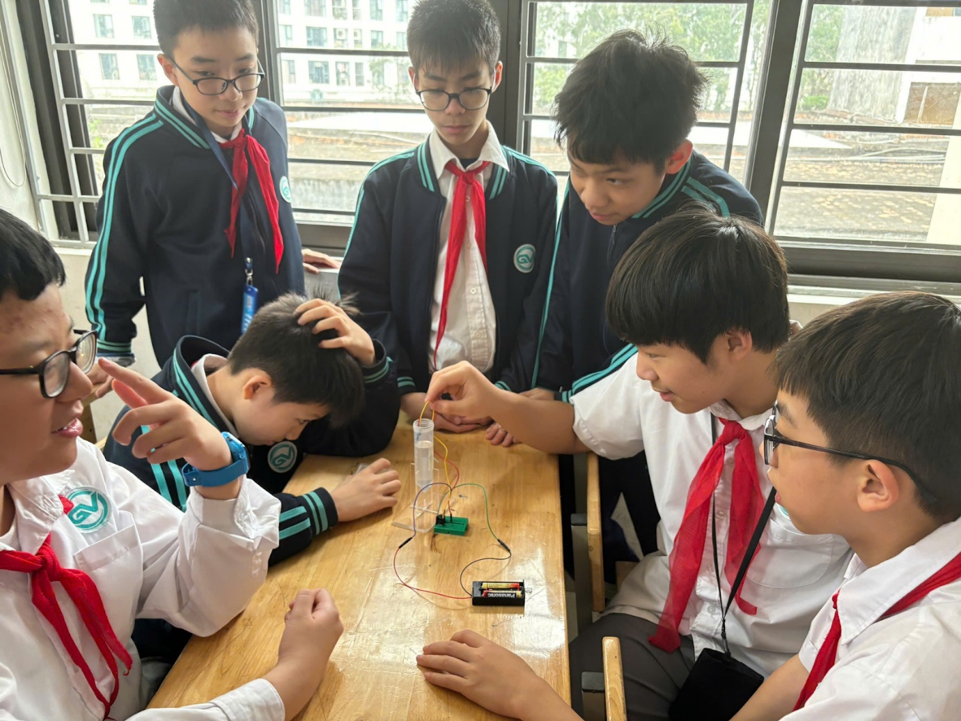 A group of boys in uniformAI-generated content may be incorrect.