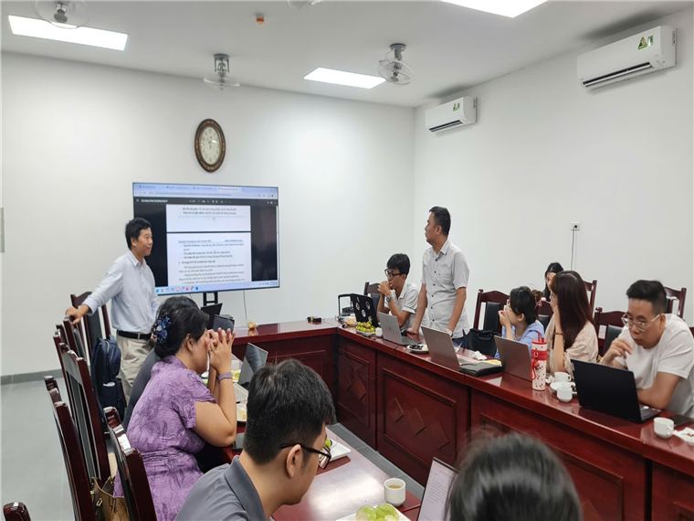 A group of people in a roomAI-generated content may be incorrect.