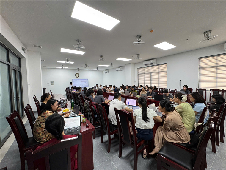 A group of people in a roomAI-generated content may be incorrect.