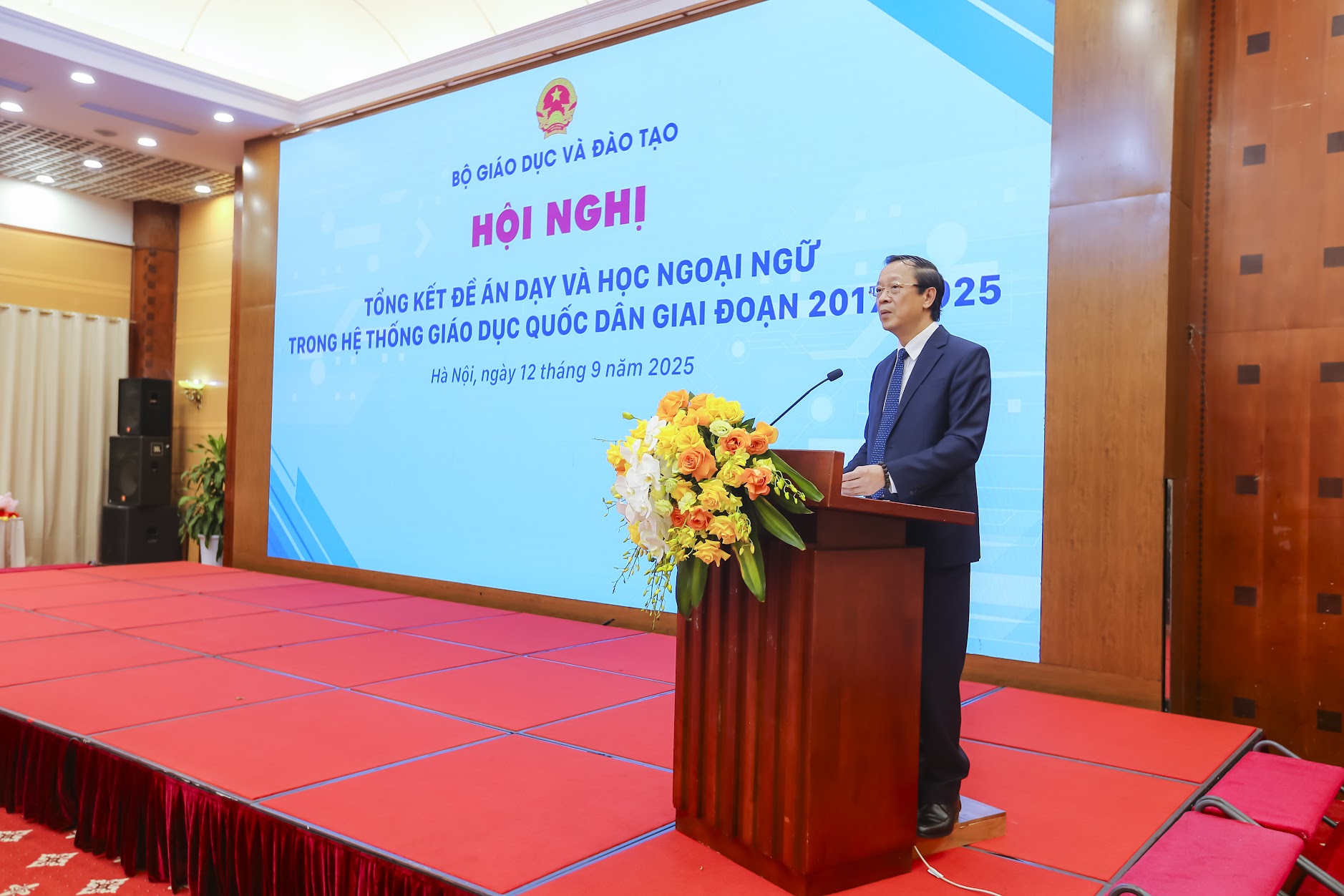 A person standing at a podiumAI-generated content may be incorrect.