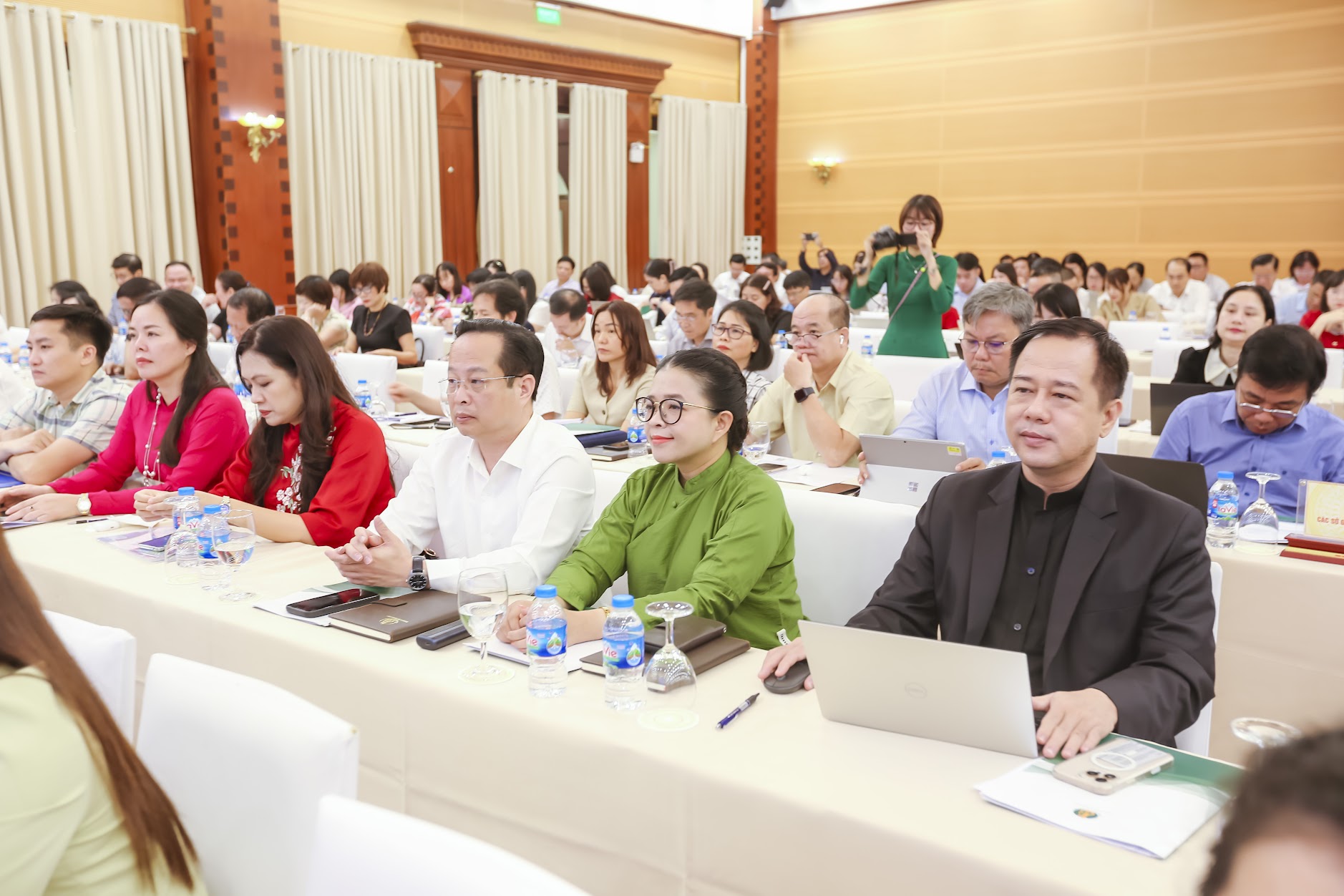 A group of people sitting at tablesAI-generated content may be incorrect.