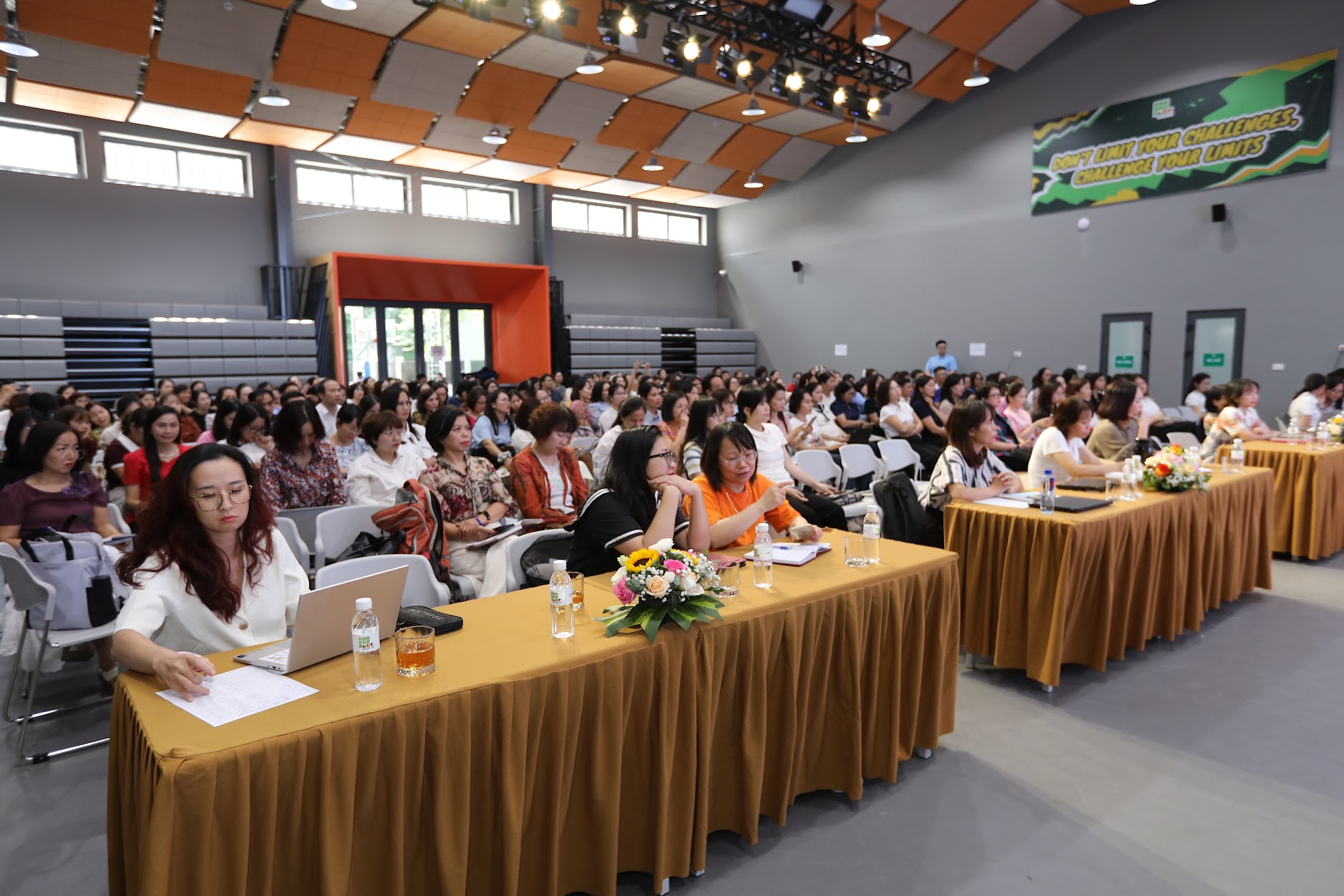 A group of people in a roomAI-generated content may be incorrect.