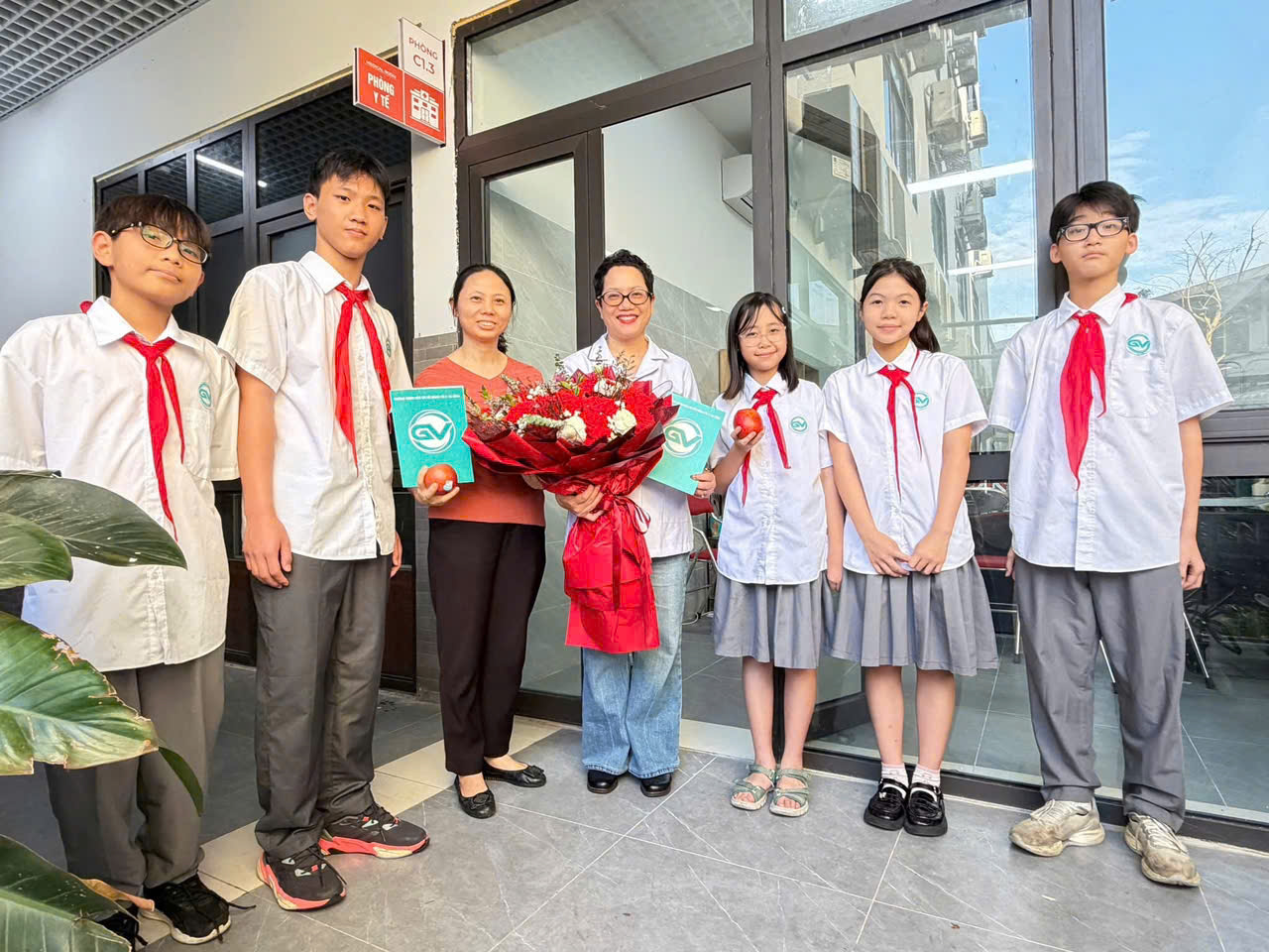 A group of people posing for a photoDescription automatically generated