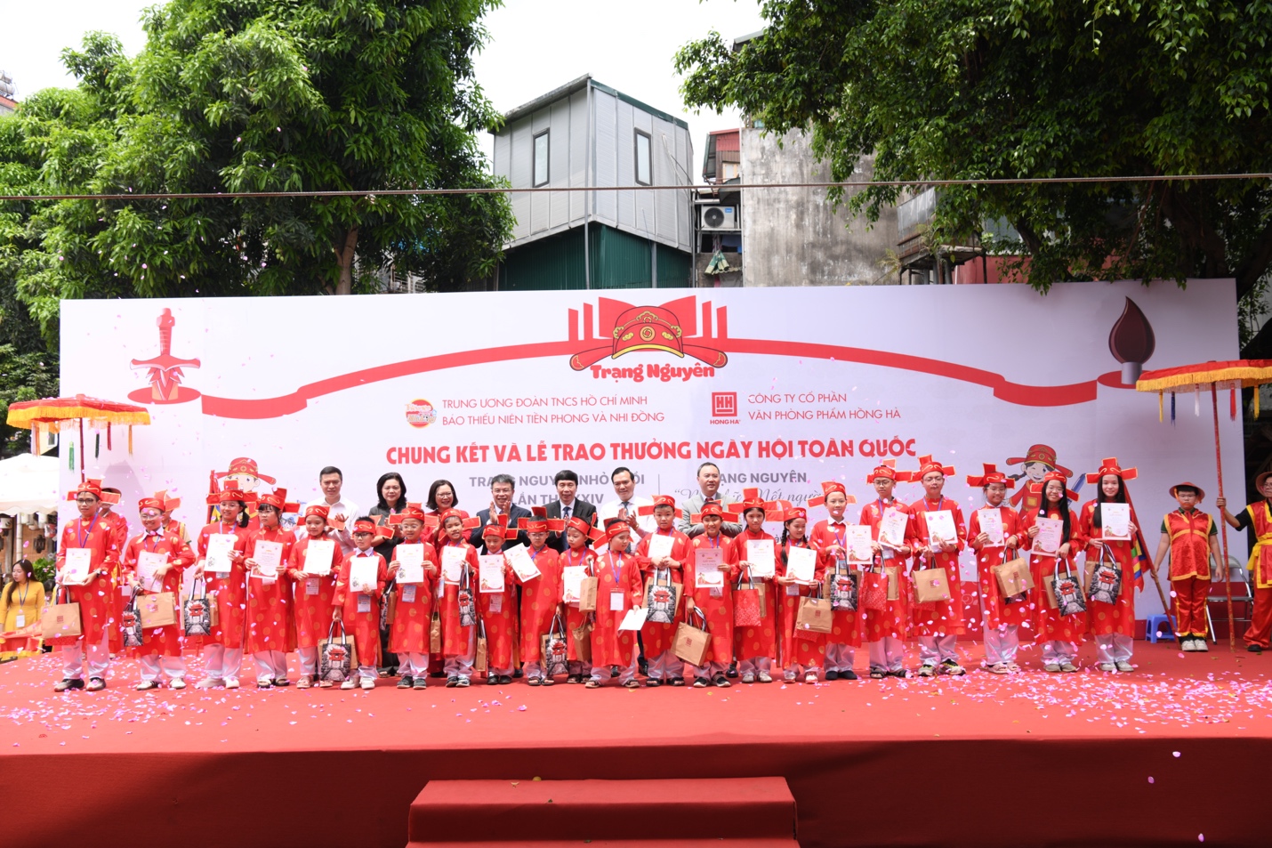 A group of people in red dressesDescription automatically generated