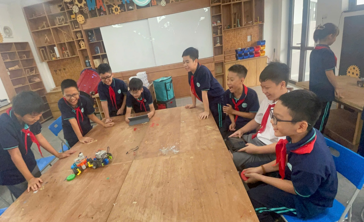 A group of boys sitting around a tableAI-generated content may be incorrect.